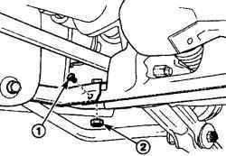 Расположение болта (1) и гайки (2) крепления нижнего продольного рычага передней подвески