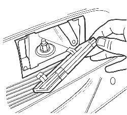 Снятие крышки боковой обивки для доступа к гайке верхнего крепления амортизатора на моделях до 2001 года